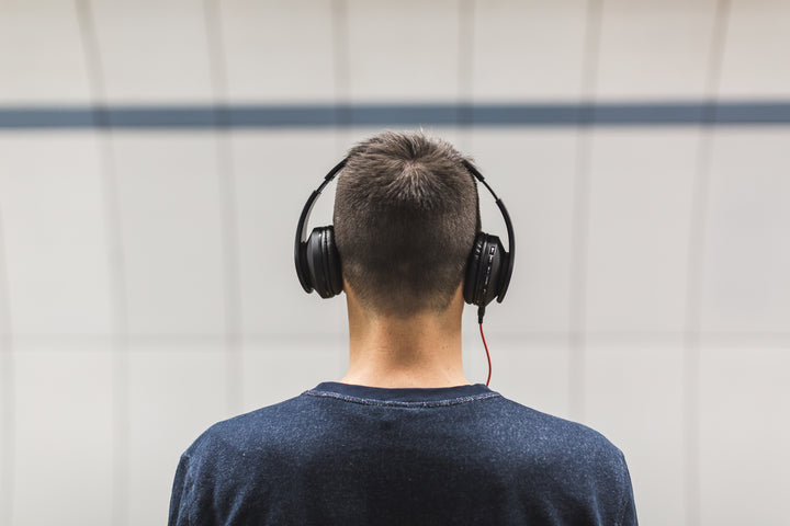 A person wearing headphones is shown, emphasizing audio products. The banner promotes headphones and audio Collection